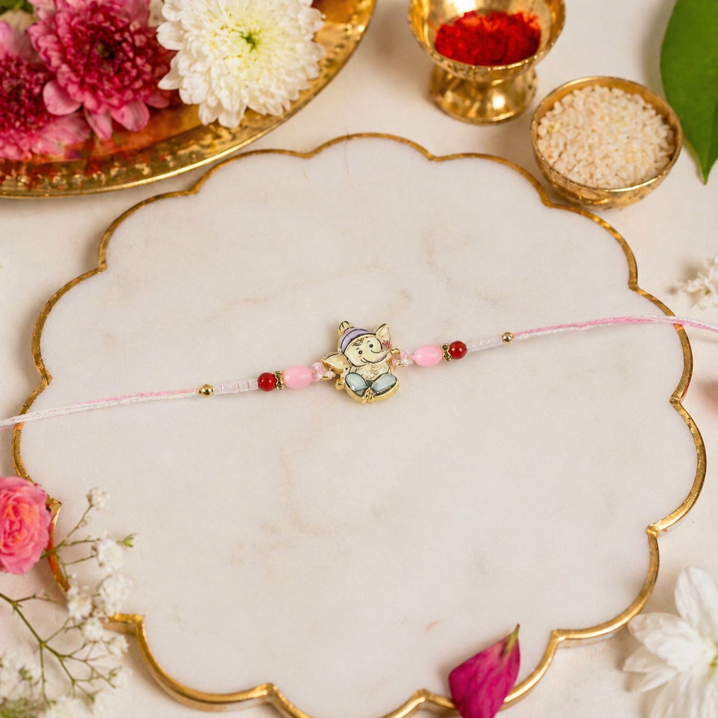 Colorful designer Ganesha Rakhi on white background