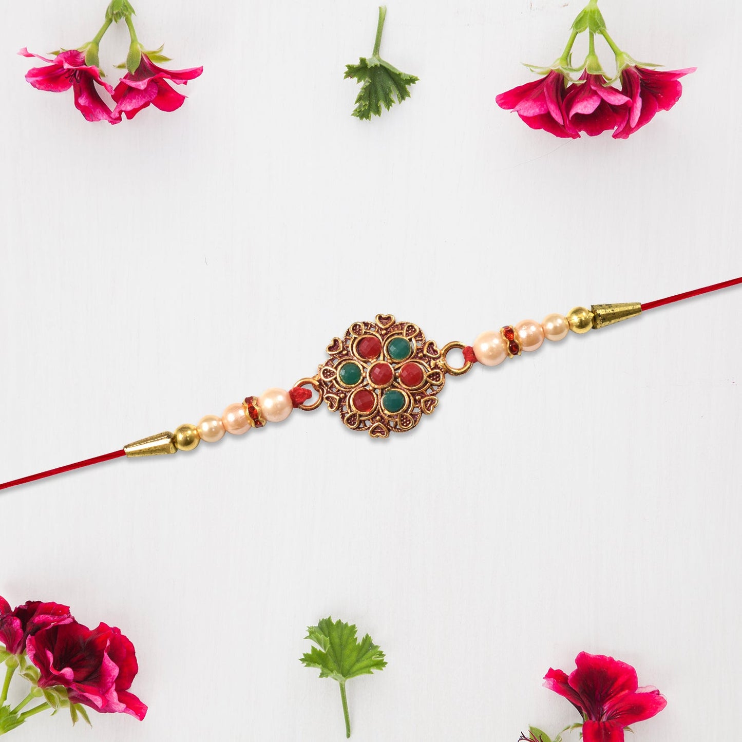 Traditional styled designer Rakhi with vibrant floral meenakari centerpiece and beads