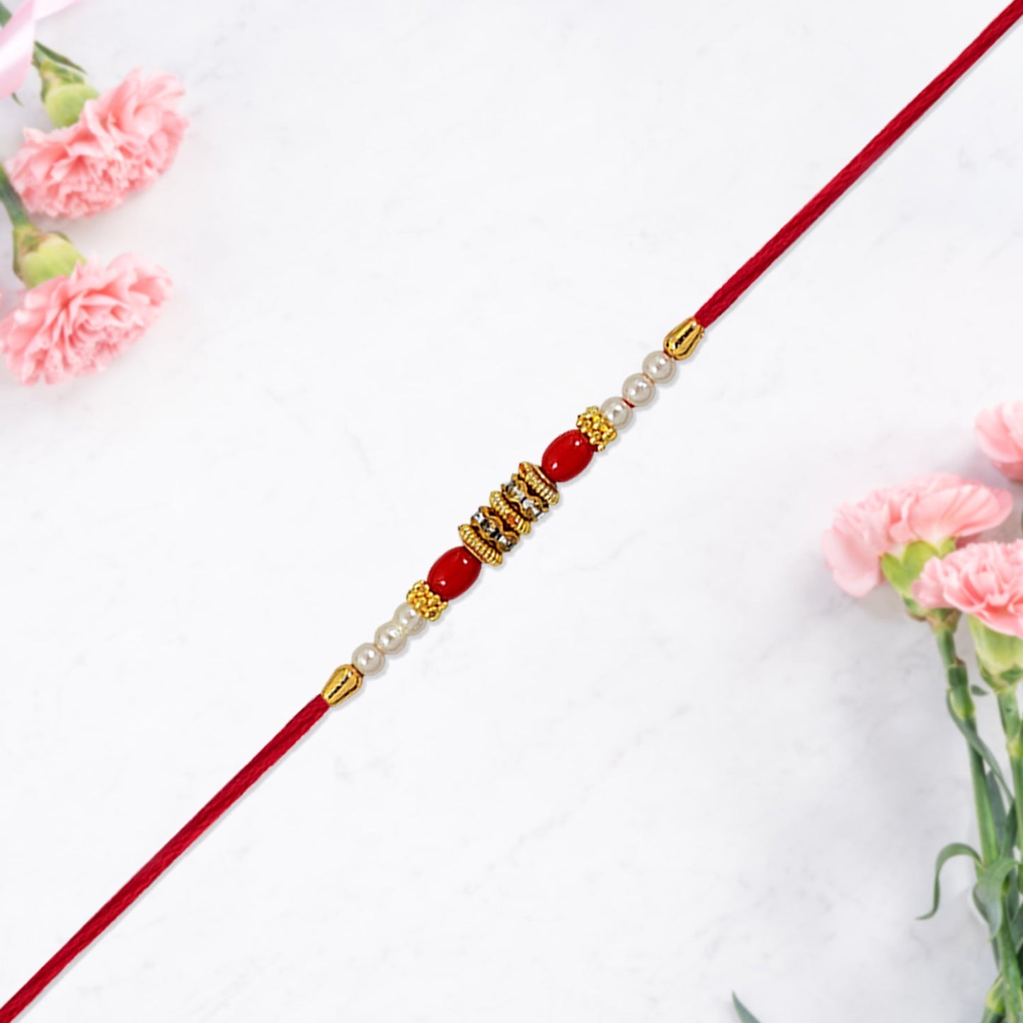 Top view of handcrafted Pearl Beaded Rakhi suitable for Raksha Bandhan pooja rituals.