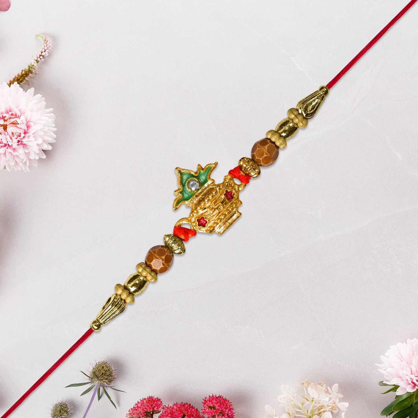 Brother wearing elegant Golden Kalash Rakhi symbolizing protection and sibling bond.