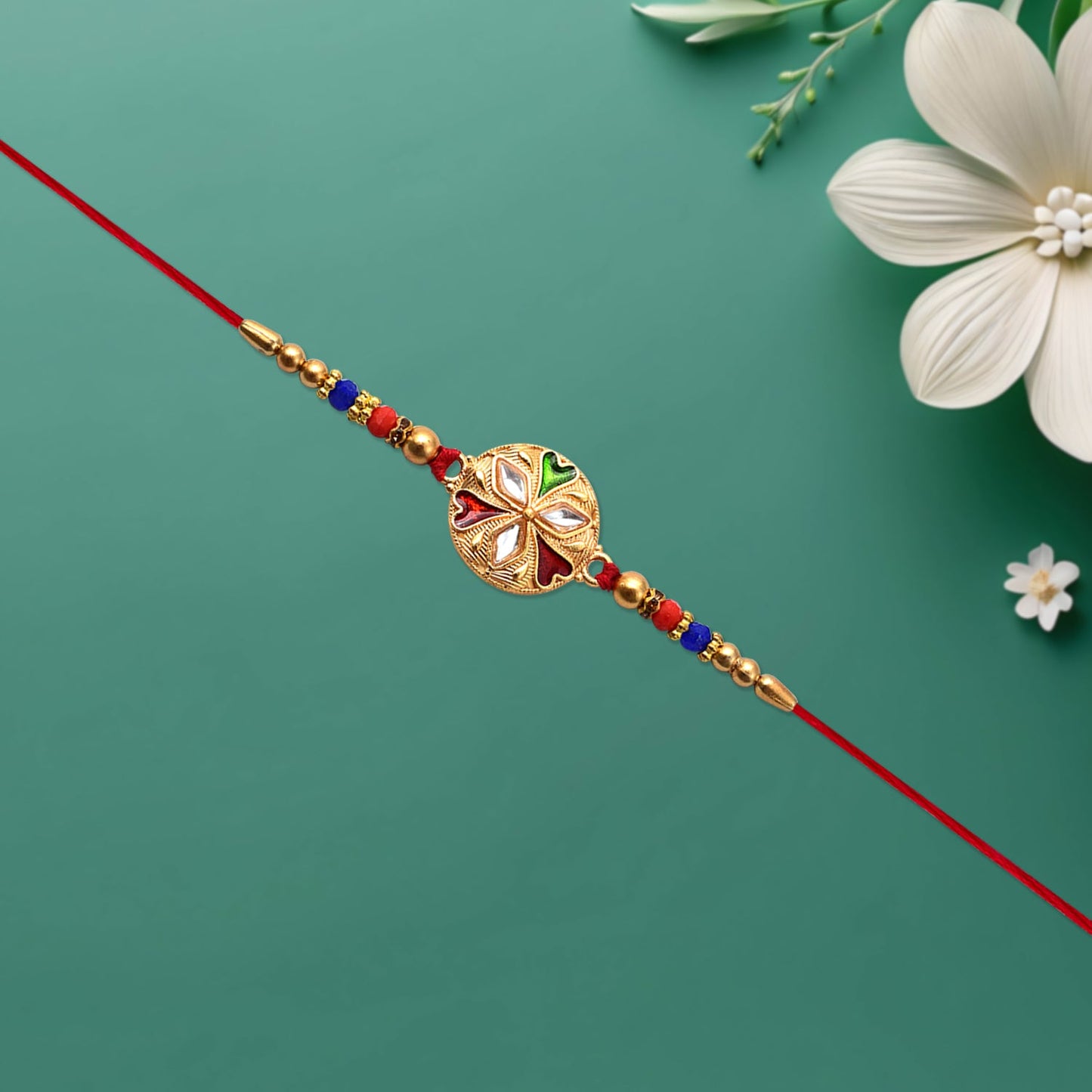 Designer floral rakhi showcasing mirror work and bead accents