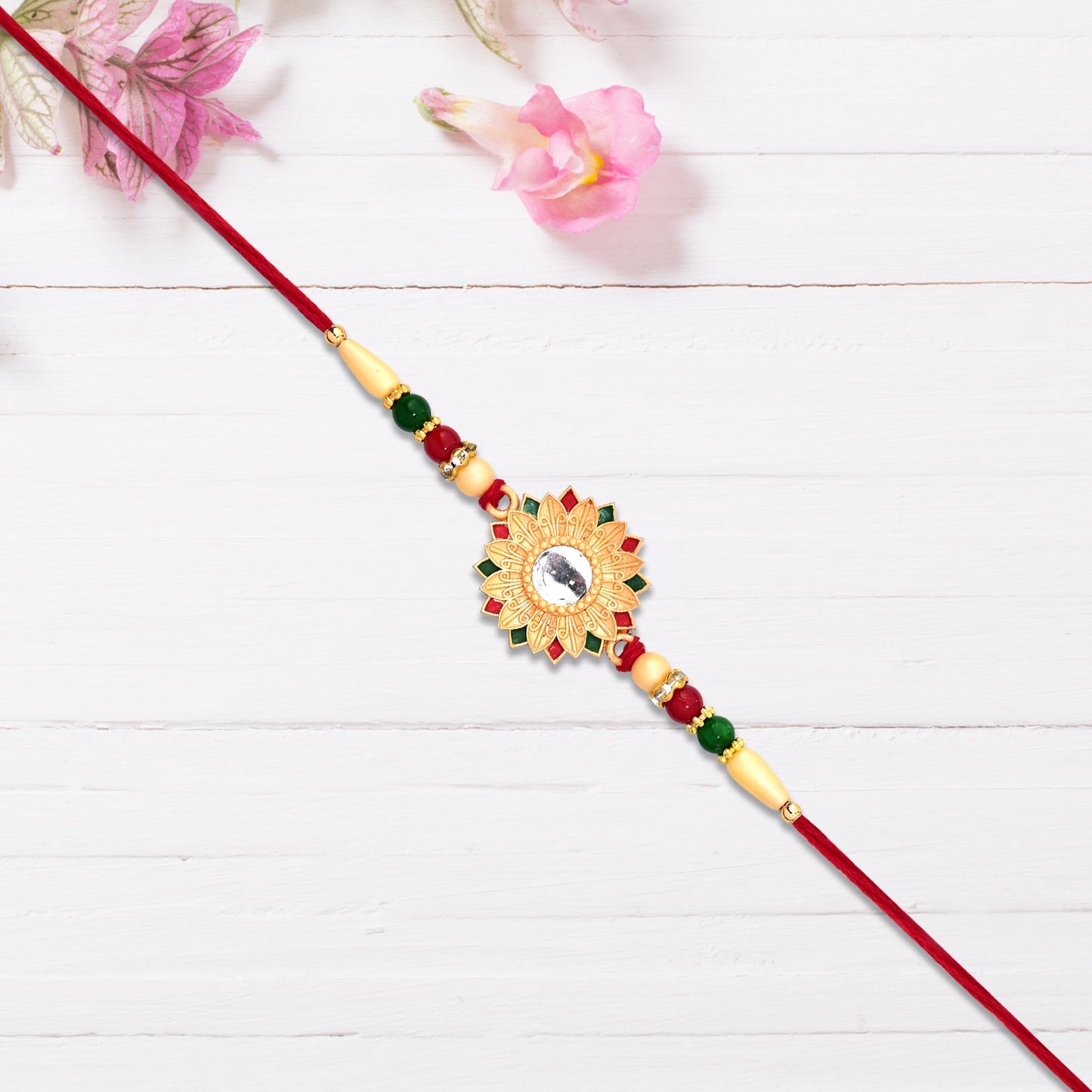Handcrafted floral Rakhi with mirror, perfect for brotherly love