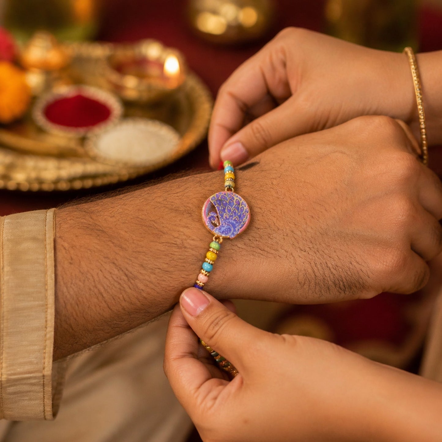 Detailed view of the Peacock Rakhi's decorative centerpiece.