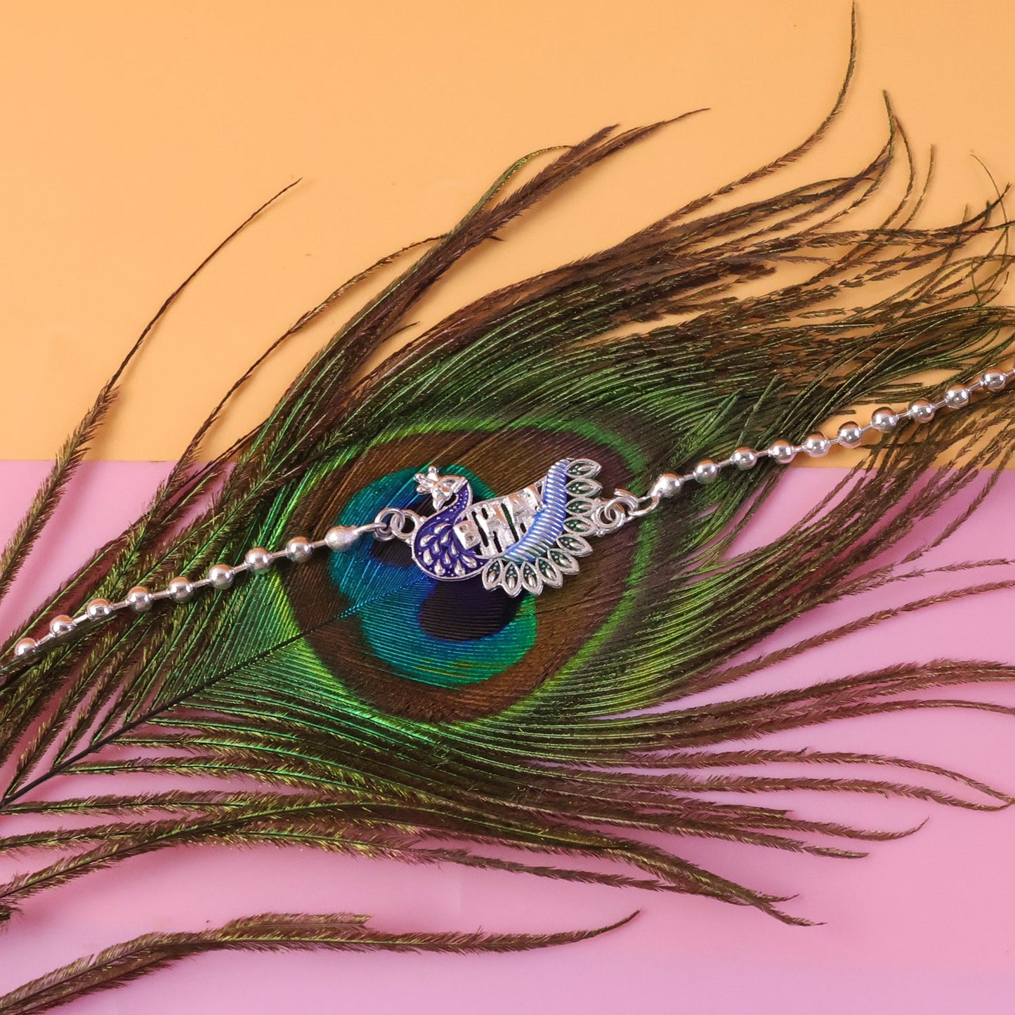 Silver finish Rakhi with intricate bead details for Raksha Bandhan
