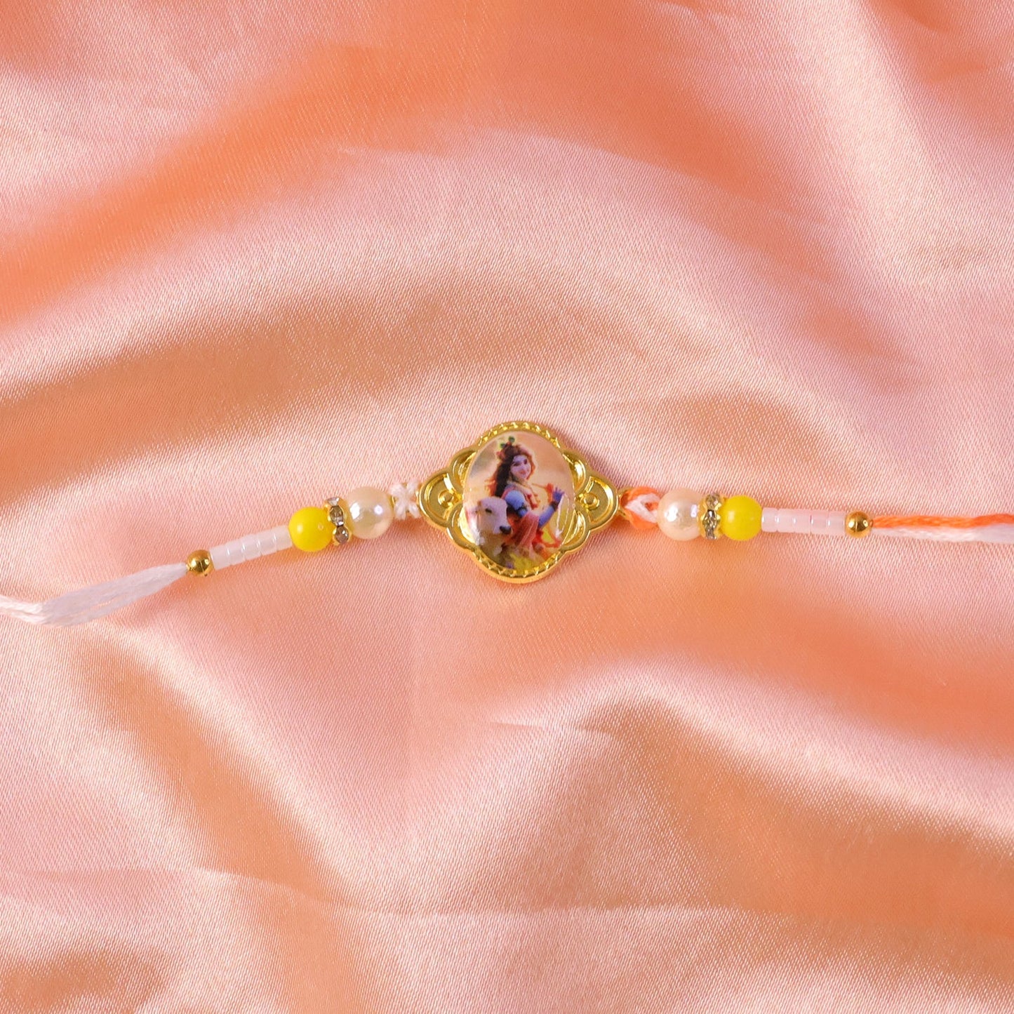 Traditional knot and thread details of Lord Krishna Rakhi