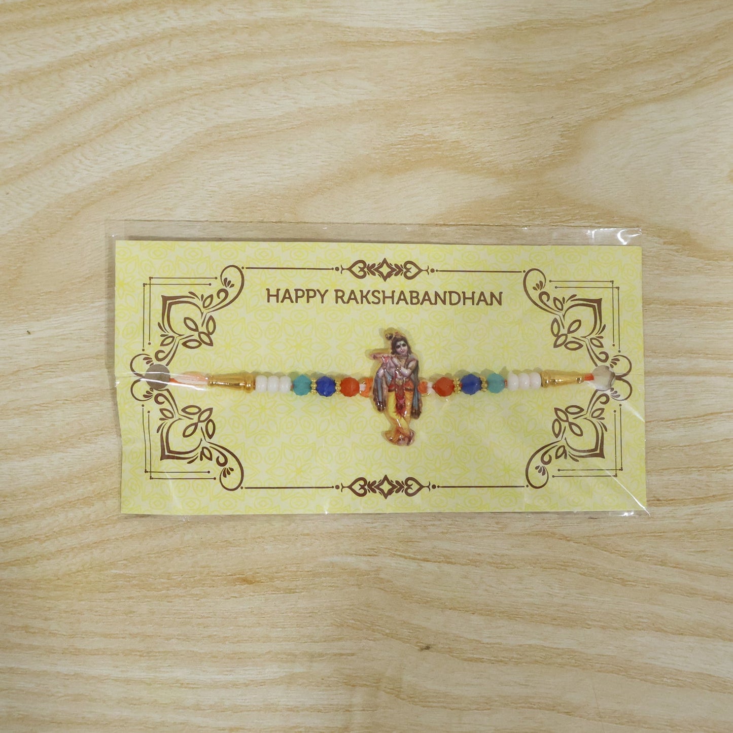 Vibrant Lord Krishna Rakhi with colorful bead accents