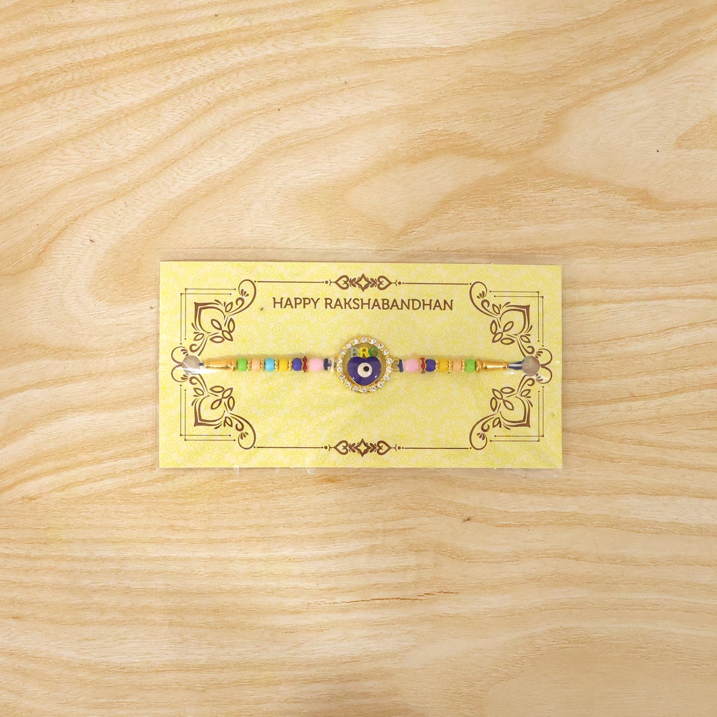 Elegant evil eye Rakhi on decorative background