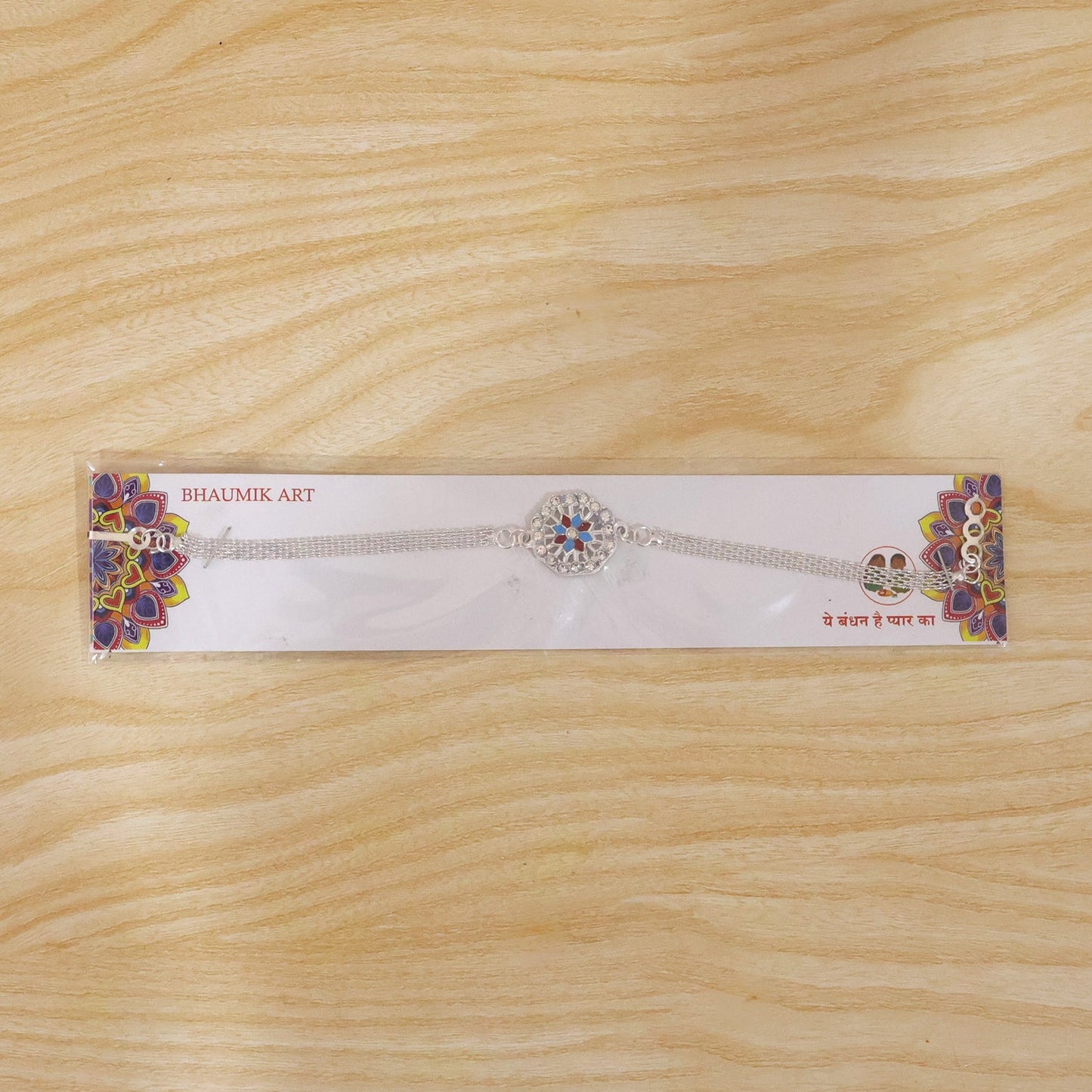 Festive Rakhi with crystals and soft thread for brother