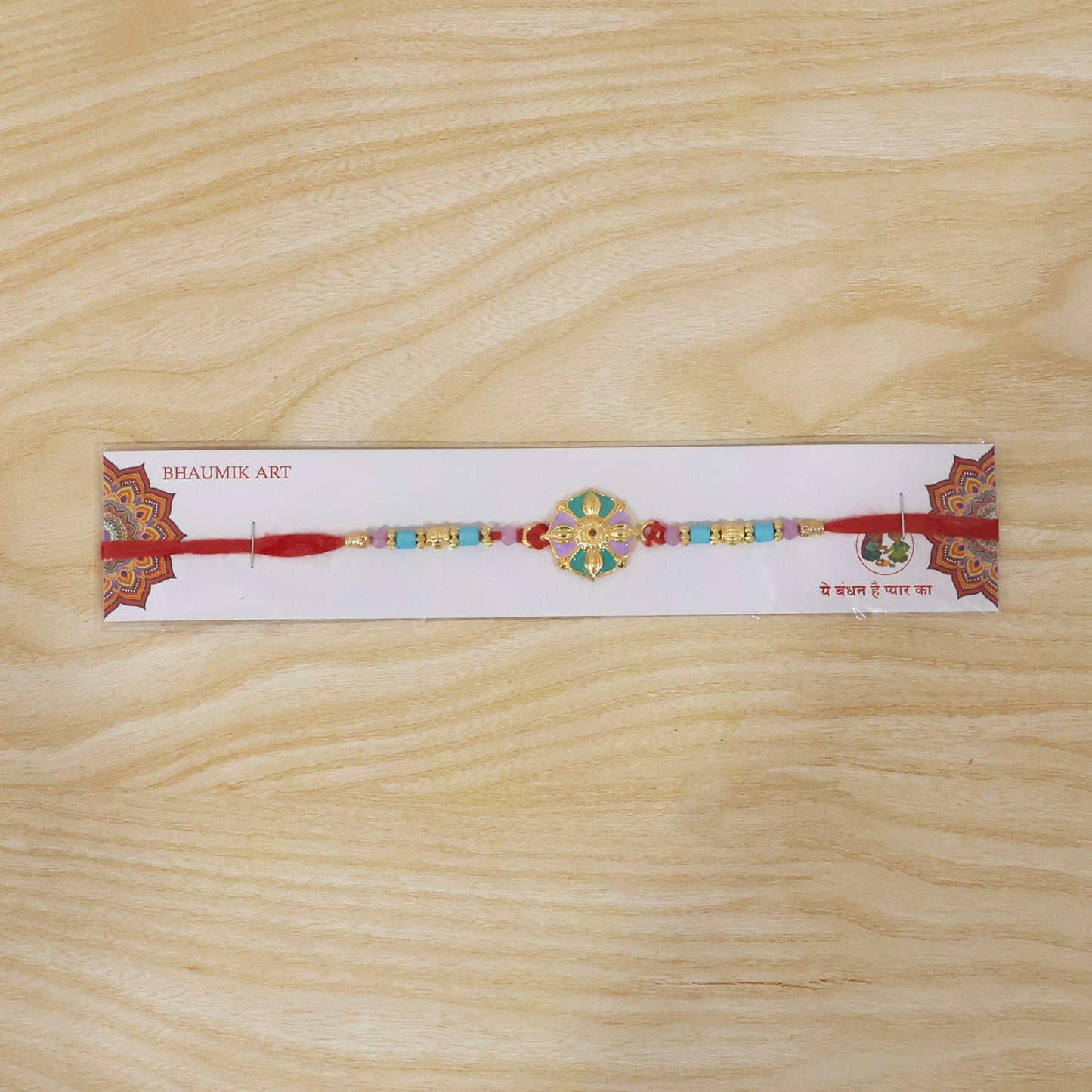 Close-up of colorful beads on flower motif rakhi