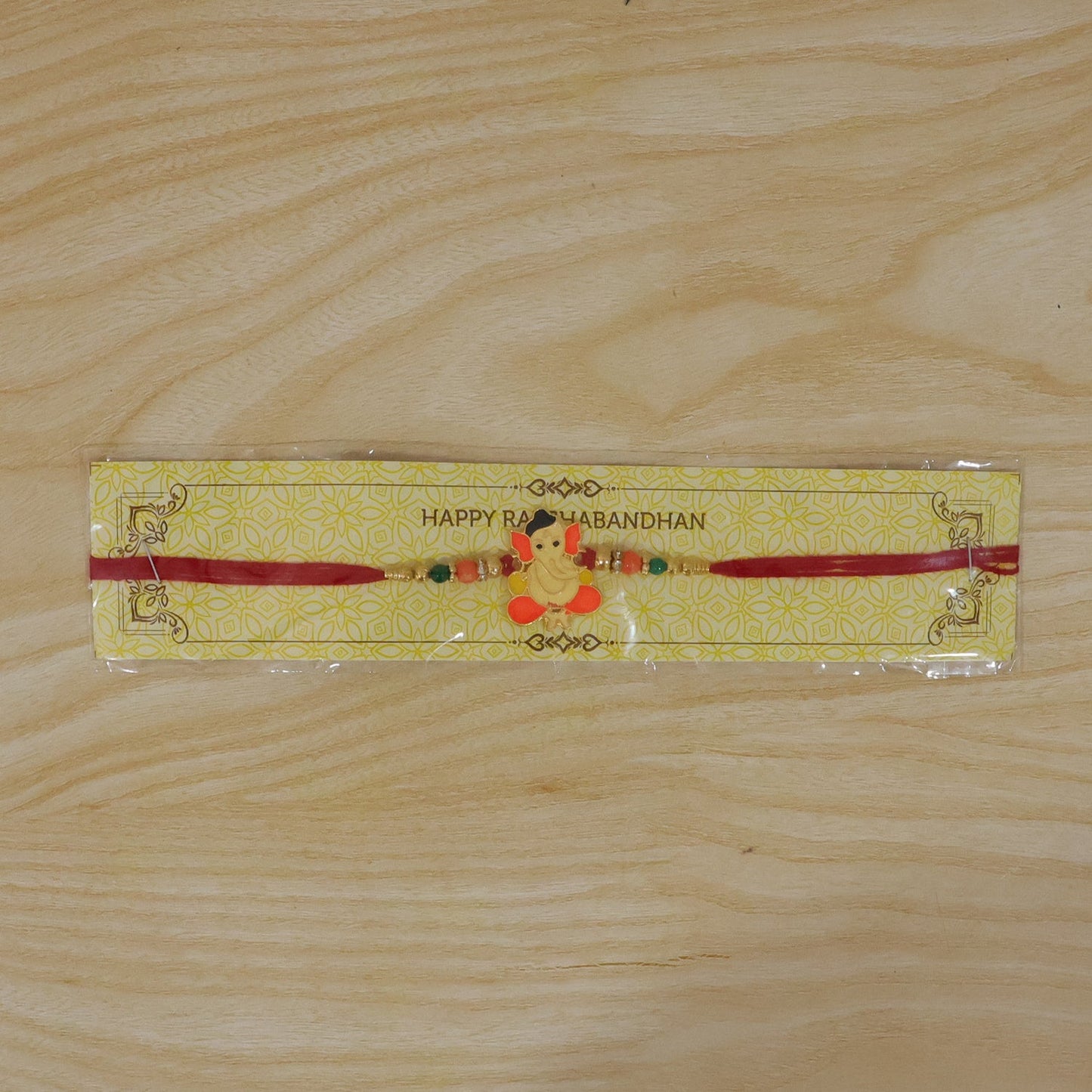 Lord Ganesha Rakhi with vibrant beads and soft thread