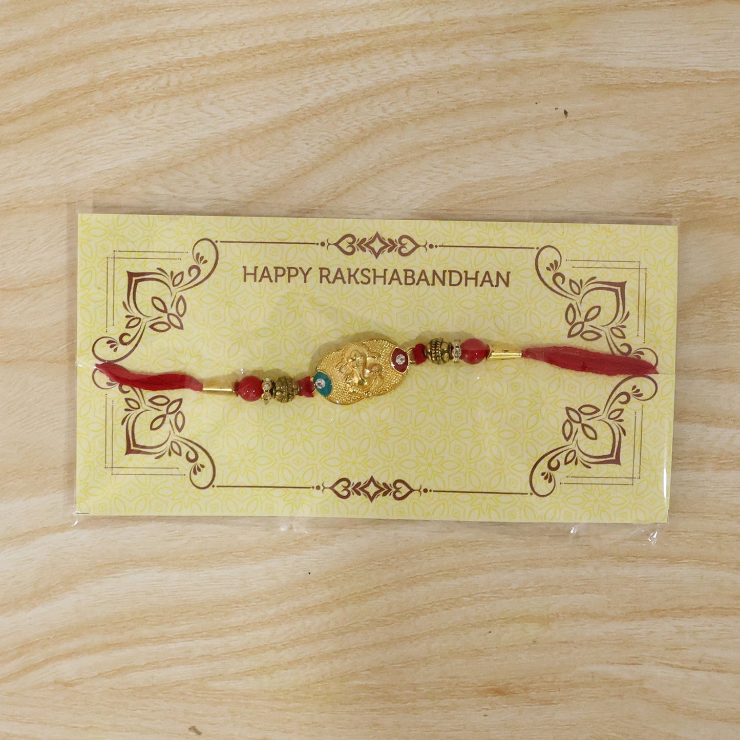 Elegant Golden Ganesh Rakhi for Raksha Bandhan celebrations