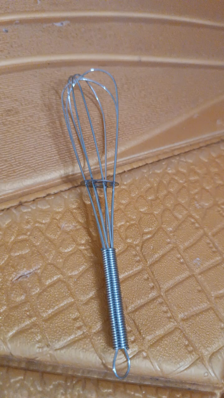 Stainless steel kitchen whisk with flat design for gentle whisking