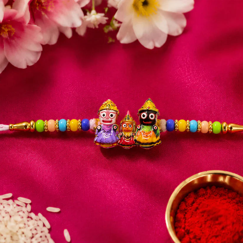 Elegant Jagannath Rakhi with divine idols and vibrant decorative beads