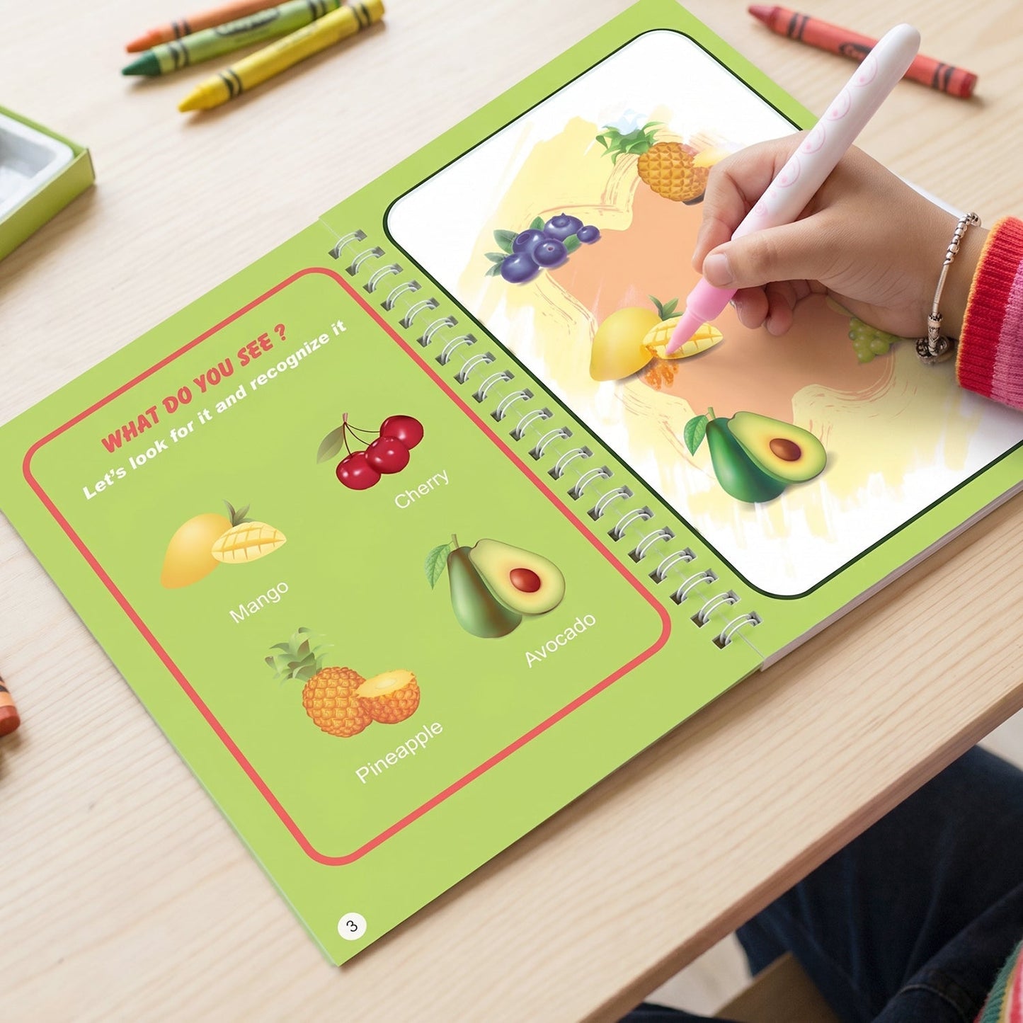 Toddlers playing with magic water book