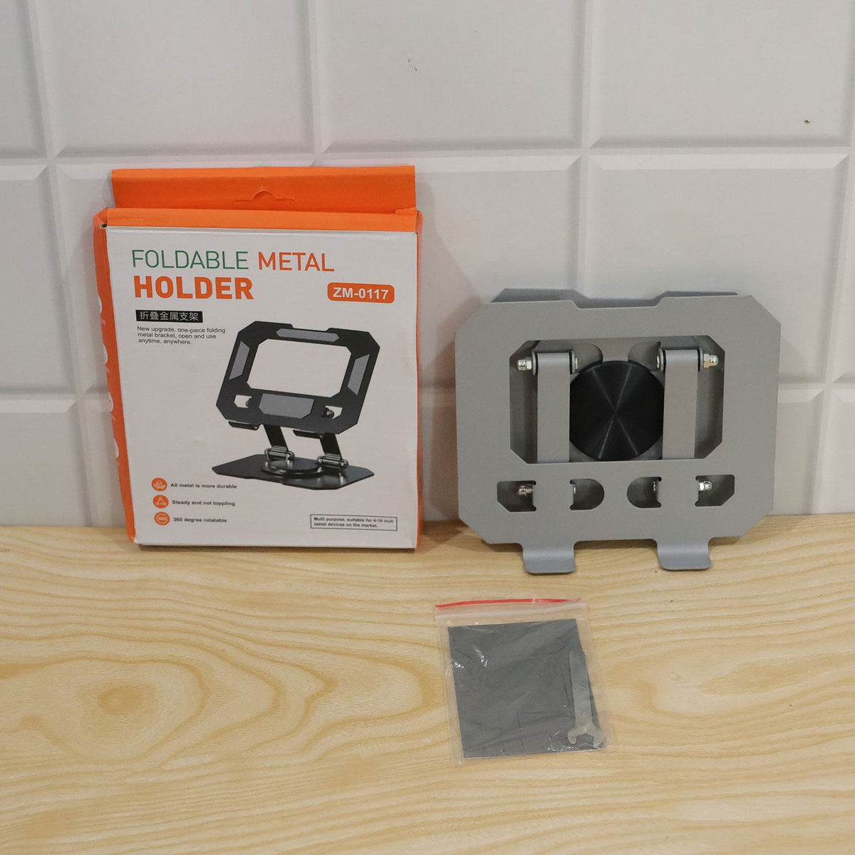 Foldable metal phone and tablet holder - actual product and box