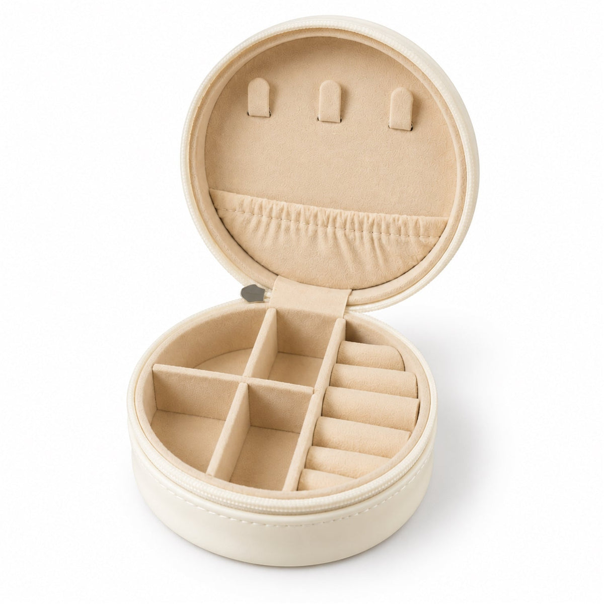 An open cream-colored round jewellery organizer with multiple compartments and ring rolls on a white background.