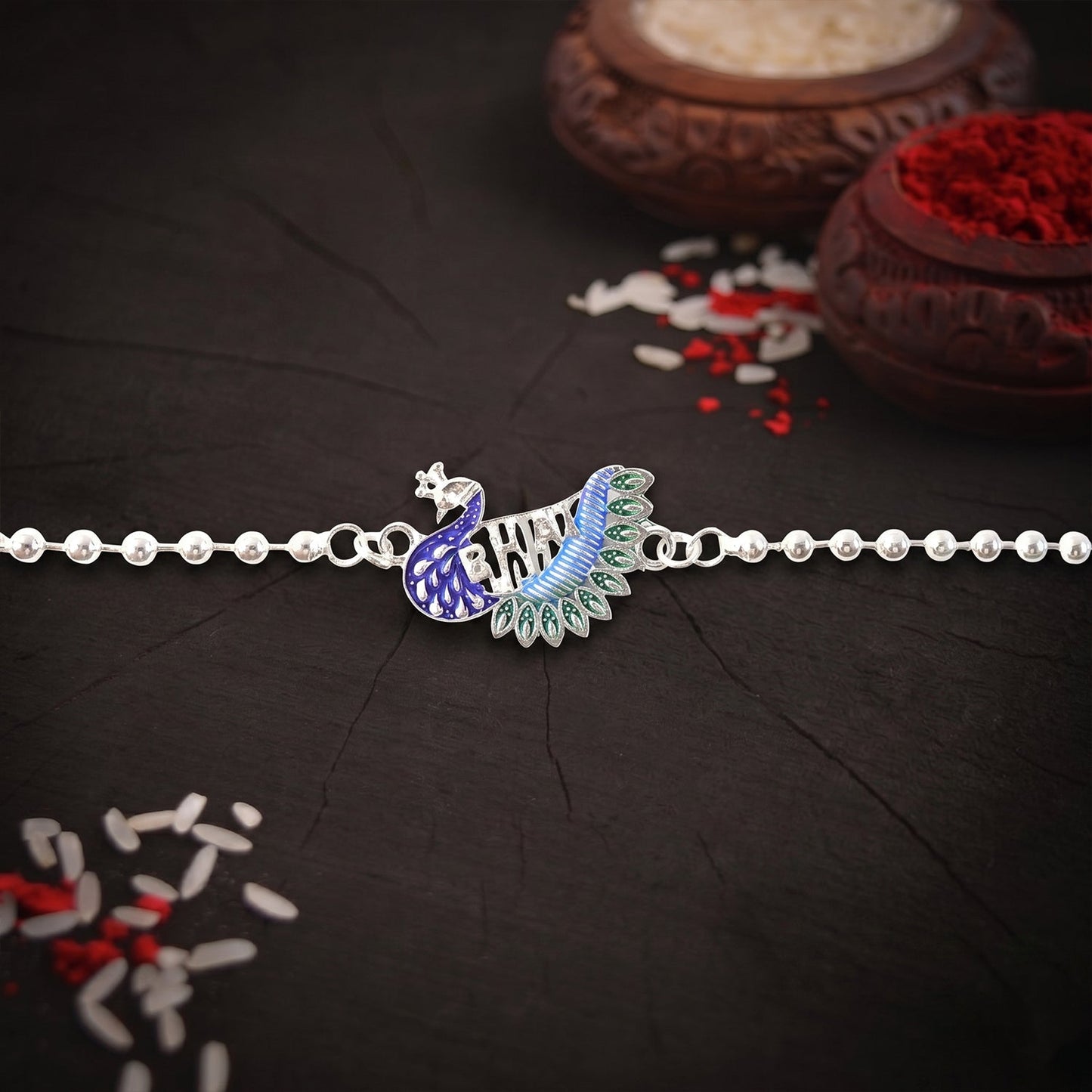 Silver finish peacock Rakhi with beaded chain thread, stylish and traditional