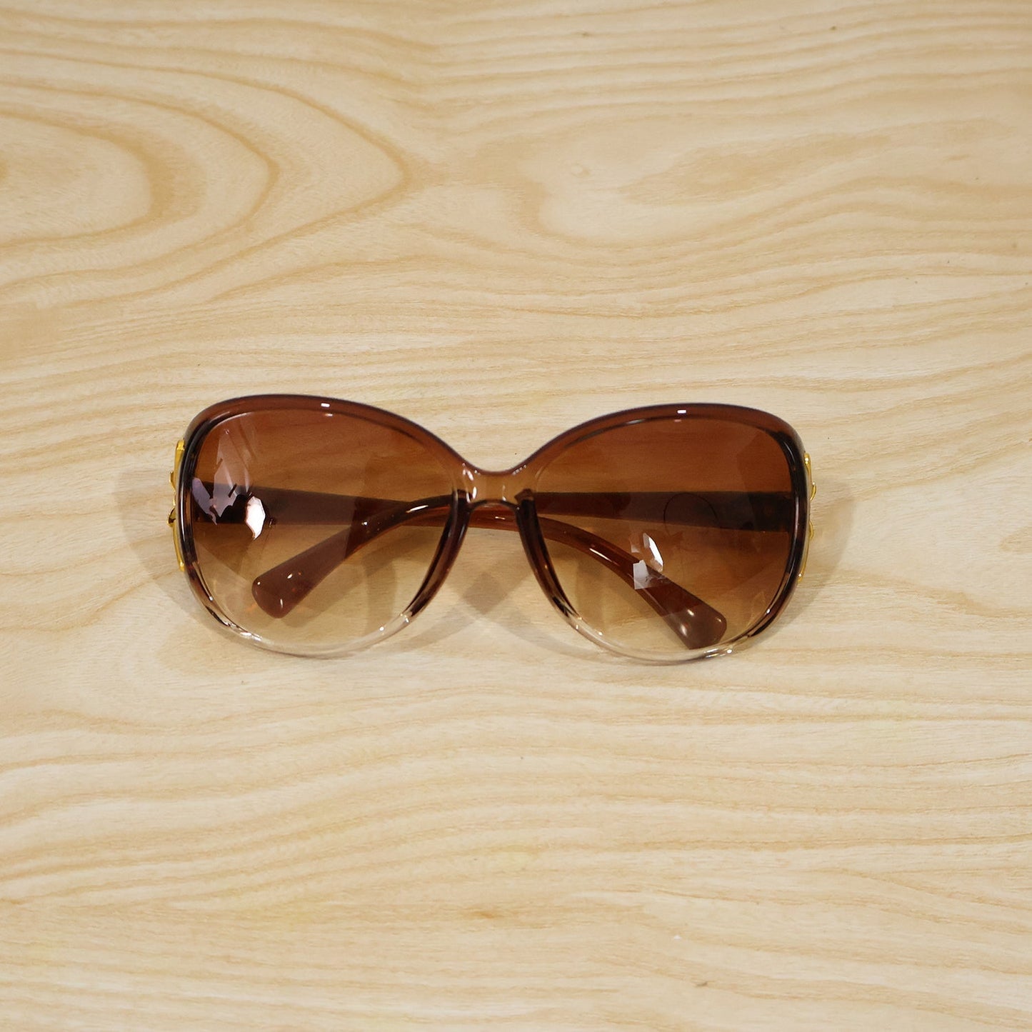 Detailed view of the oversized sunglasses' frame and temple design.