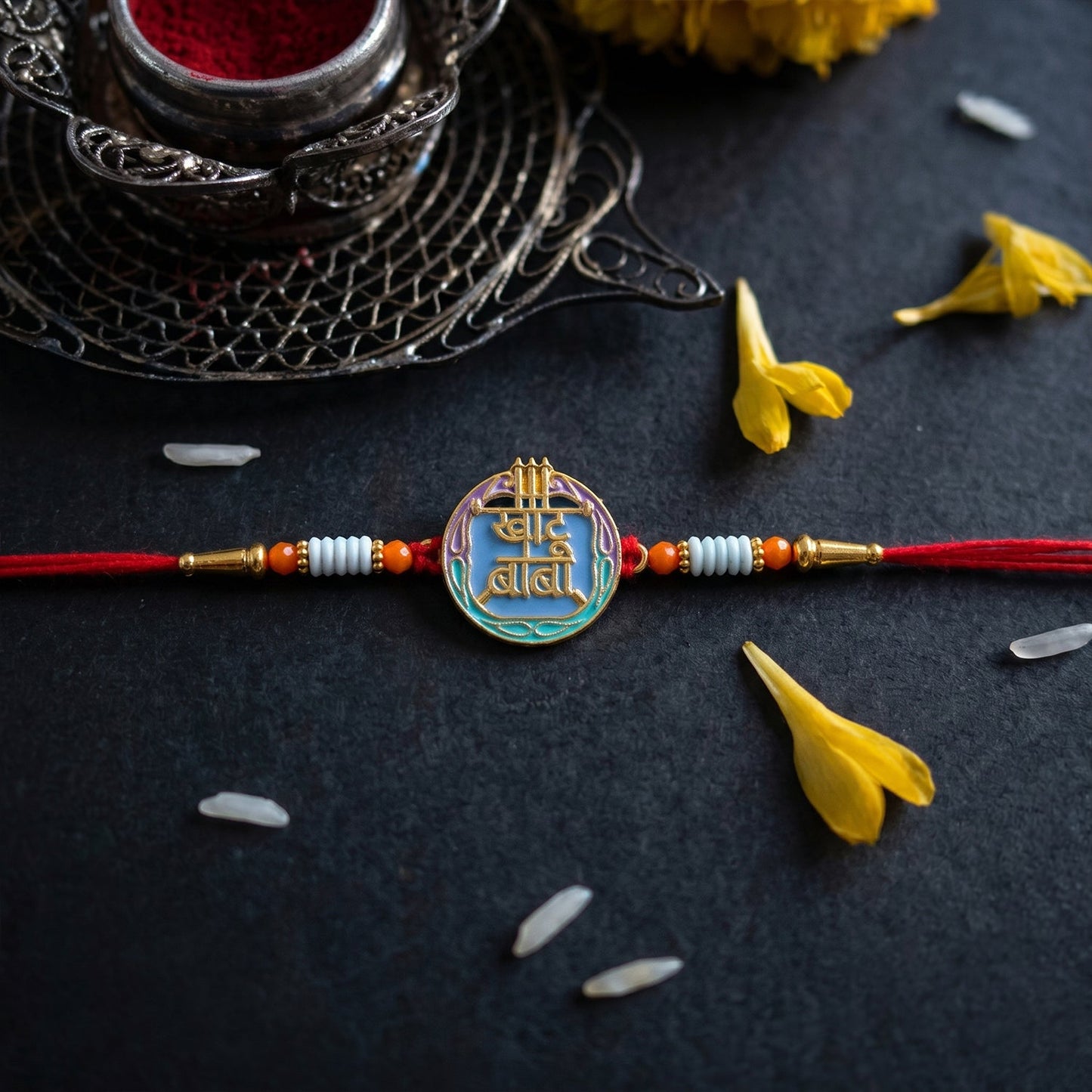 Colorful rakhi with decorative beads and religious symbol front view