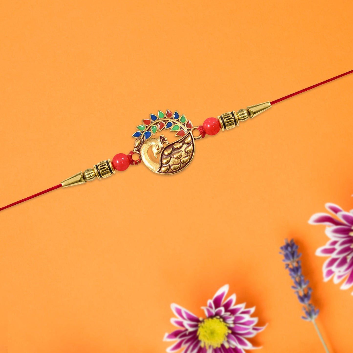 Close-up image showcasing golden enamel details on the peacock rakhi design