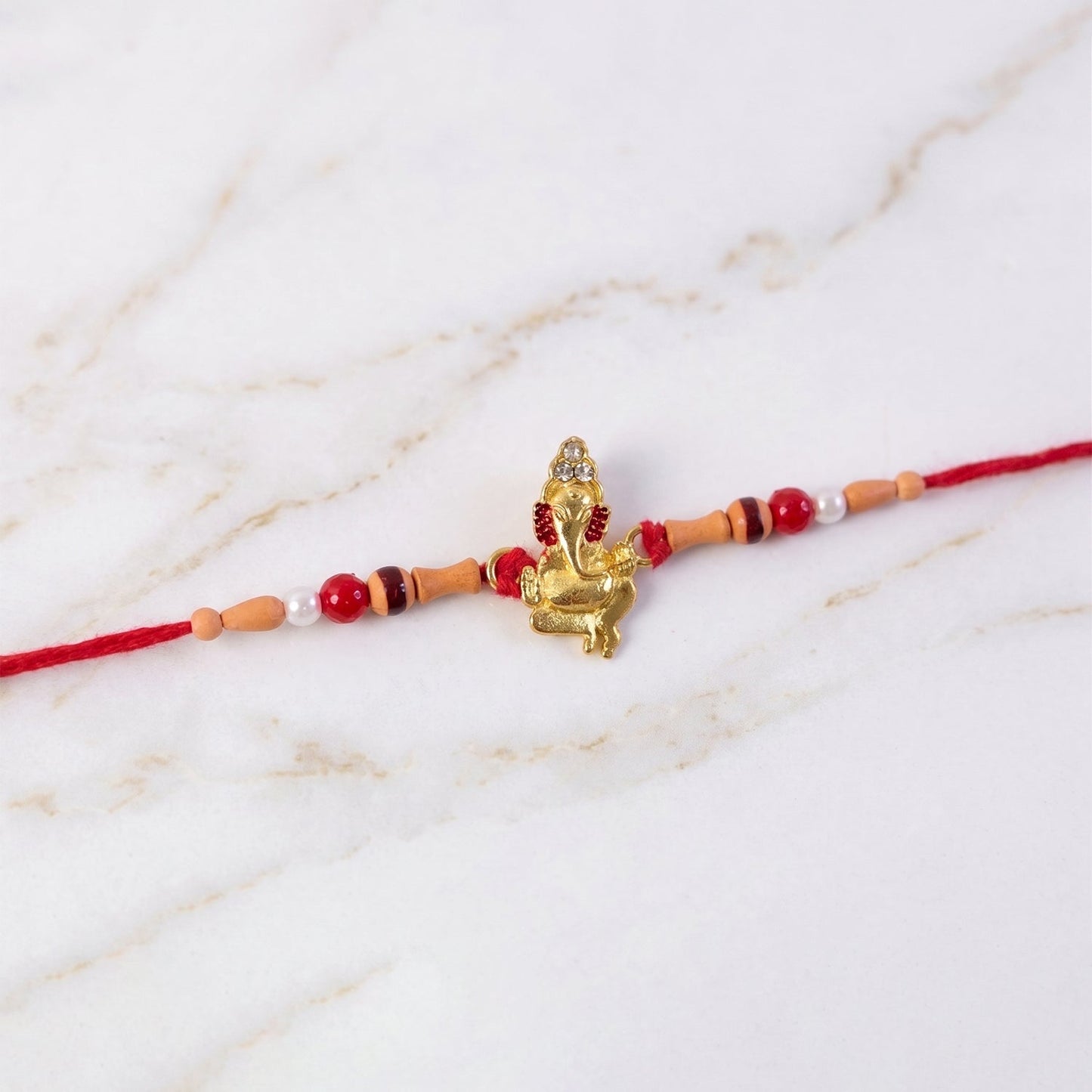 Elegant traditional rakhi with decorative beads and stylish centerpiece for festive occasions