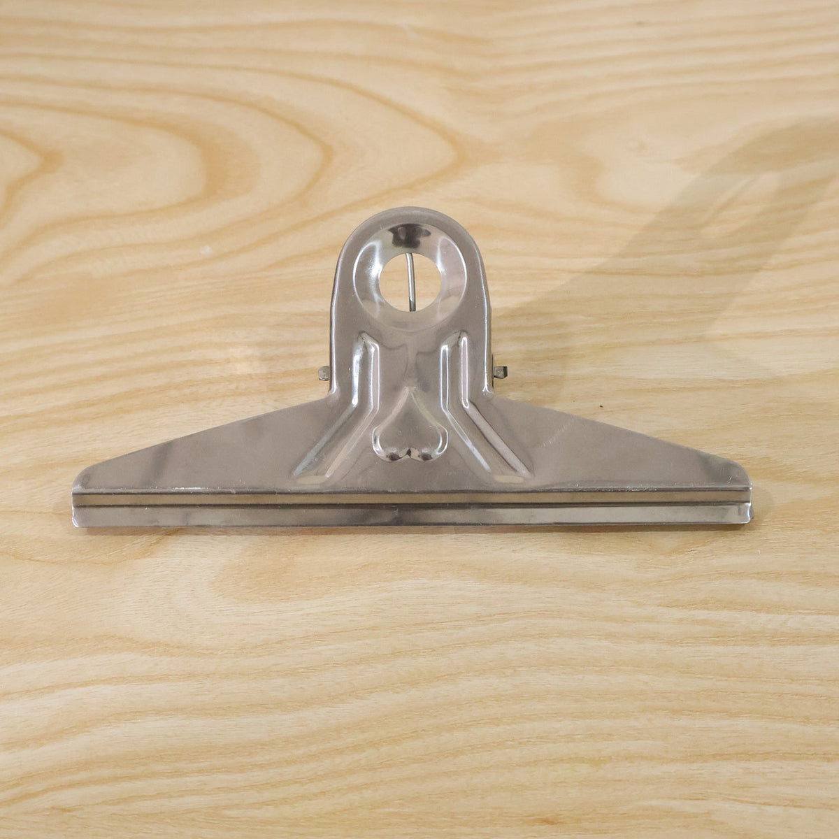 Live photo of metal bulldog binder clip