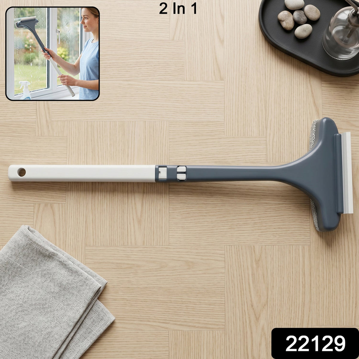 2 in 1 glass cleaner with scrubber and squeegee on a glass surface