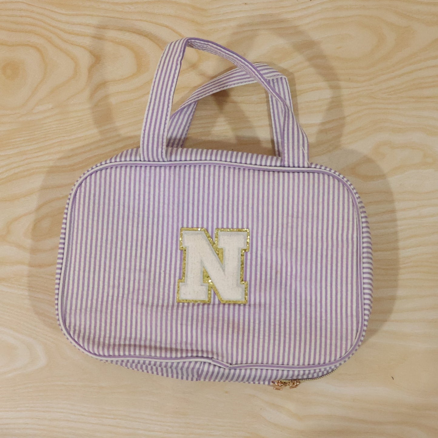 Detailed view of multi-pocket toiletry pouch