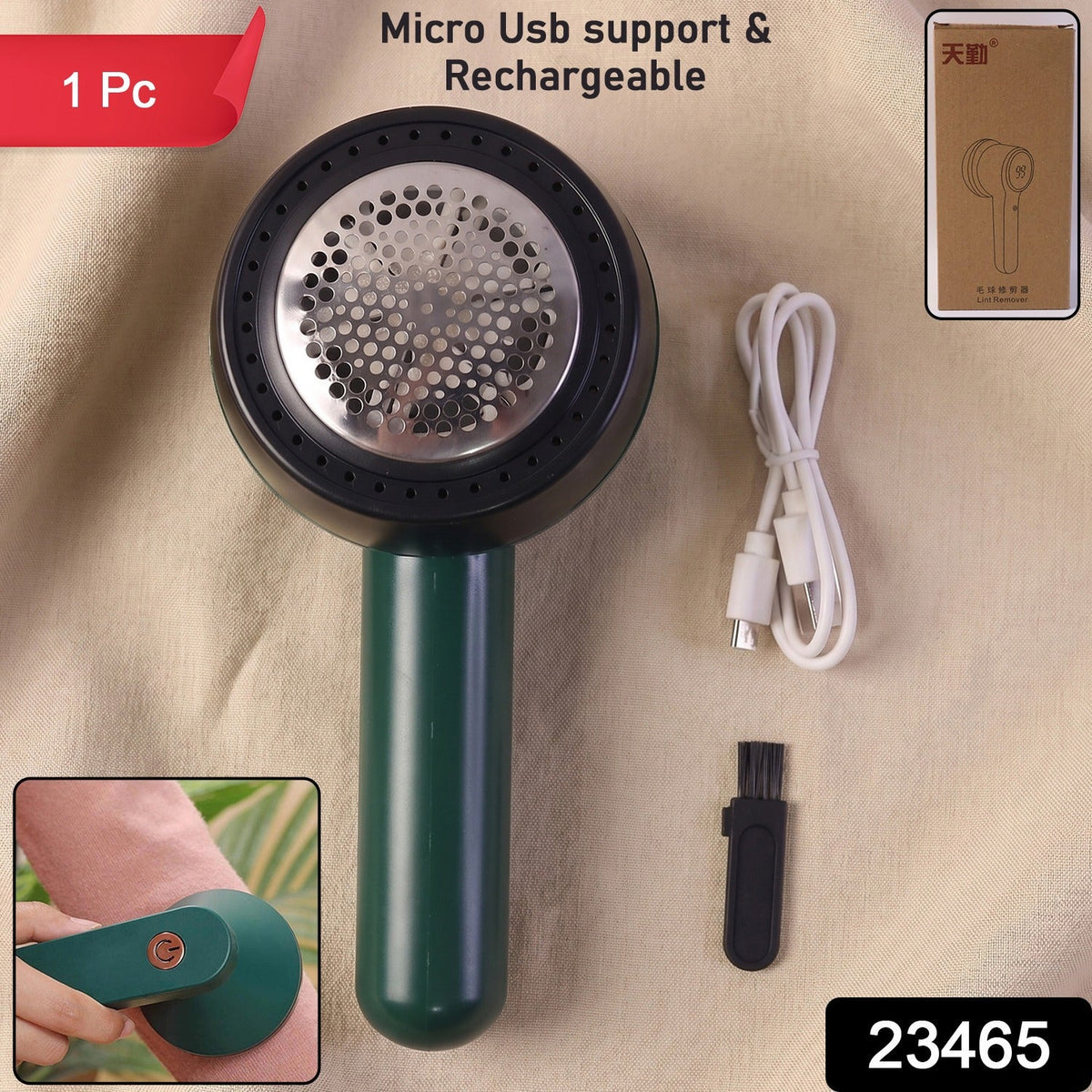 A dark green and black lint remover, white USB-C charging cable, and small black cleaning brush are displayed on beige