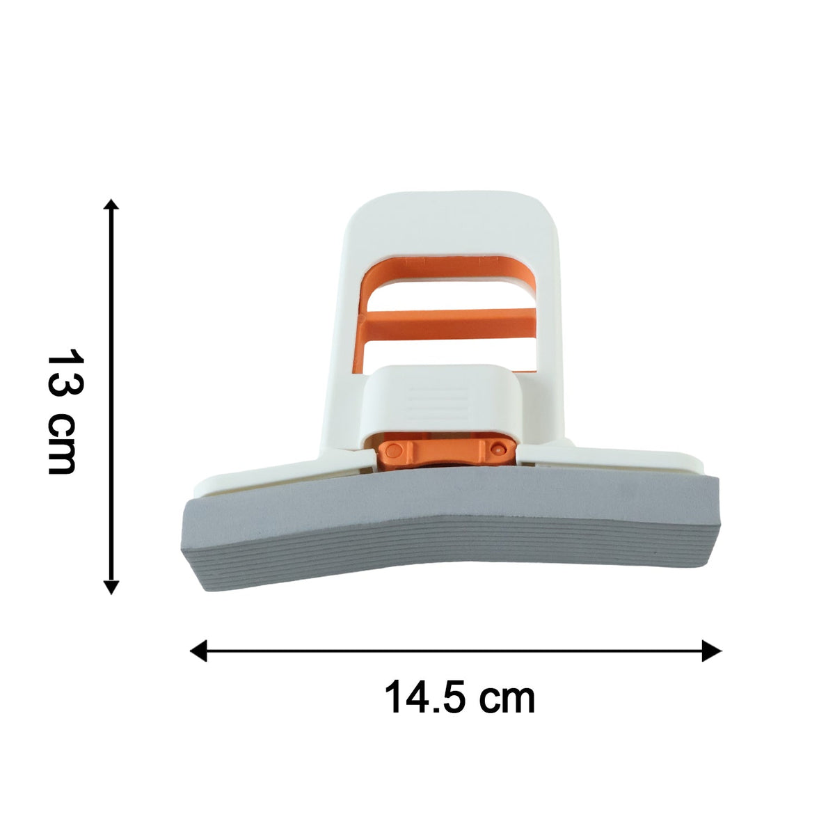 A hand squeezes the white and orange mini sponge mop over a stainless steel sink, demonstrating its water-squeezing function.