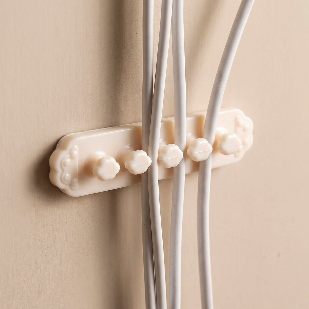 Plastic wire clips holding multiple cables