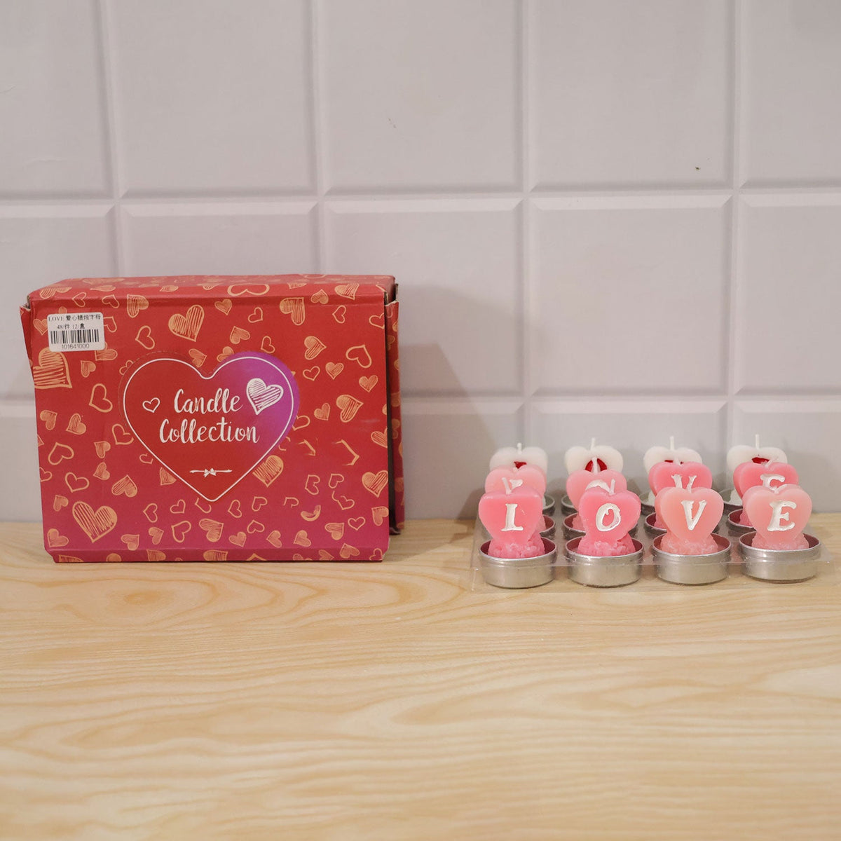 A red box labeled "Candle Collection" next to a row of six heart-shaped tealight candles on a wooden surface.