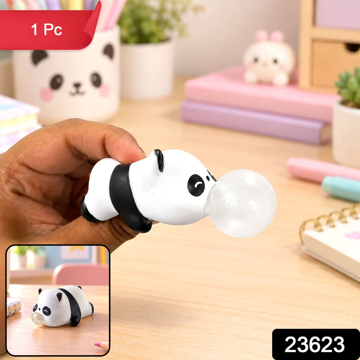 A hand holds a panda squishy toy with a clear bubble, with a small inset showing the toy on a desk.