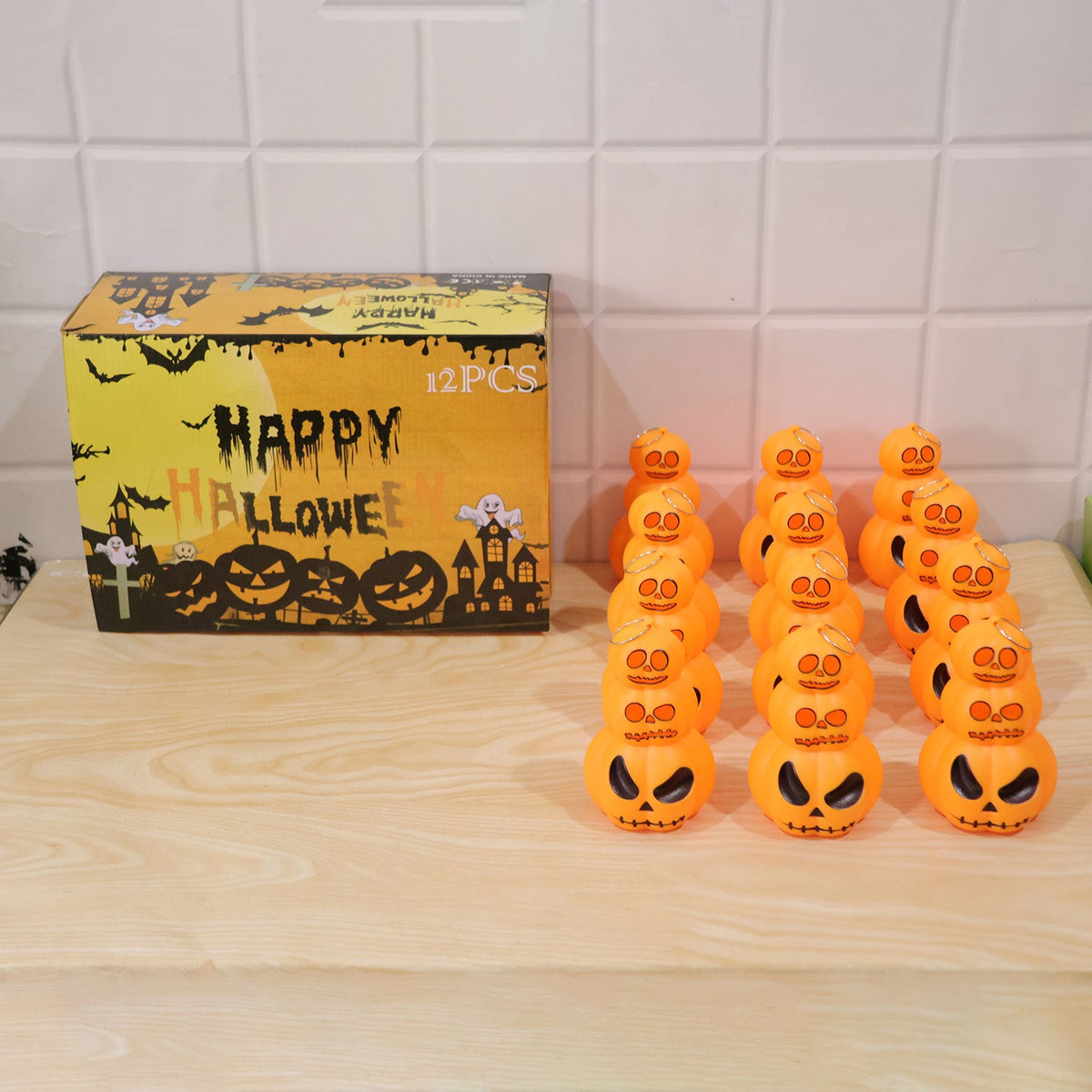 Halloween stacked pumpkin LED lanterns used as indoor party decor