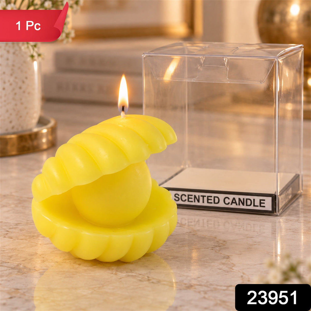 A vibrant yellow shell candle with a glowing flame is next to an empty transparent box labeled "SCENTED CANDLE".
