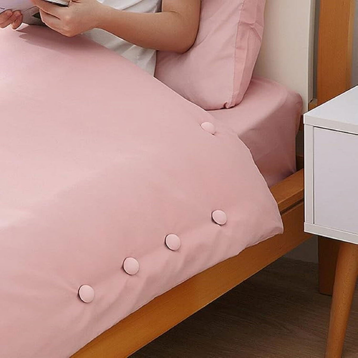 Duvet fastener buttons installed on bedding