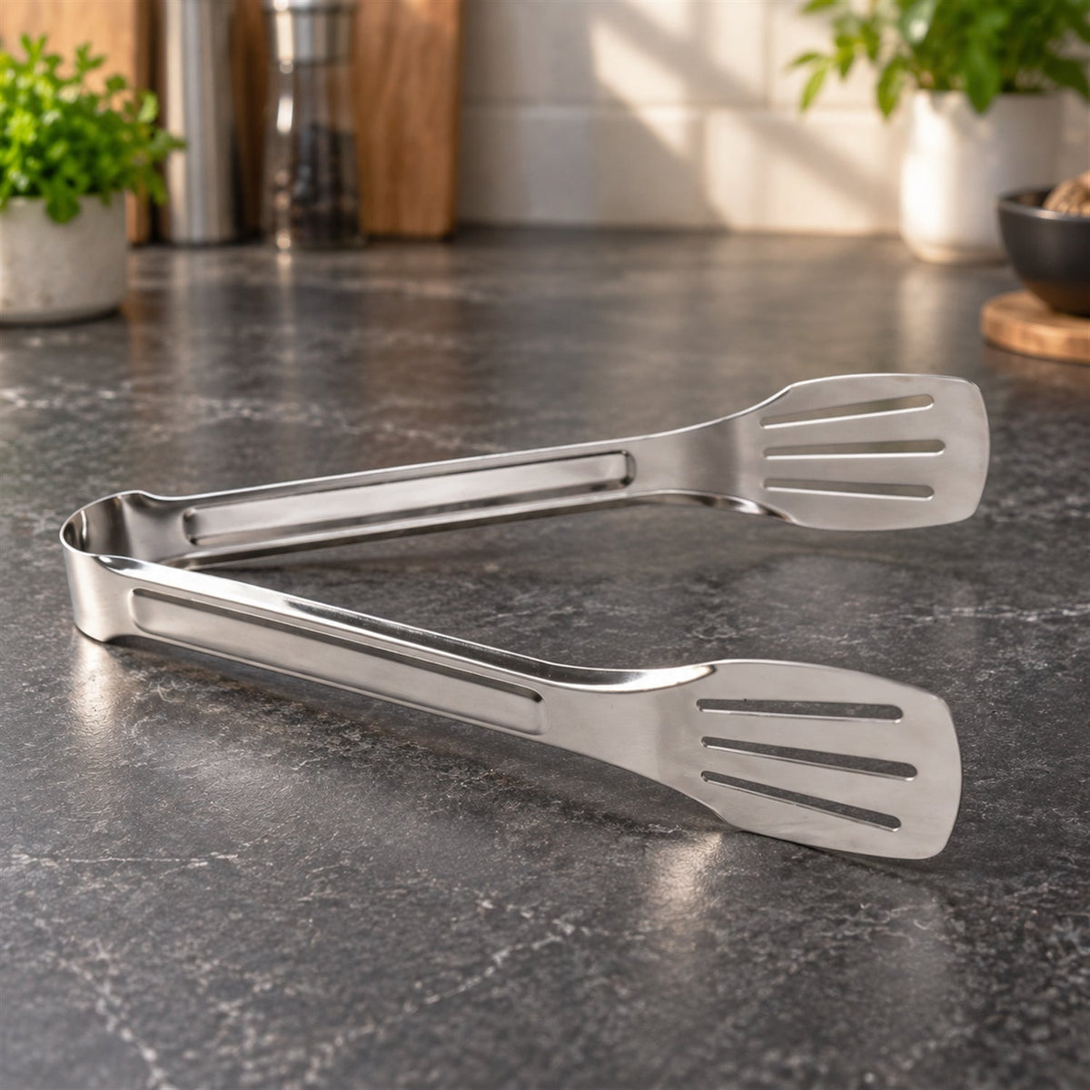 Steel tongs cooking serving food