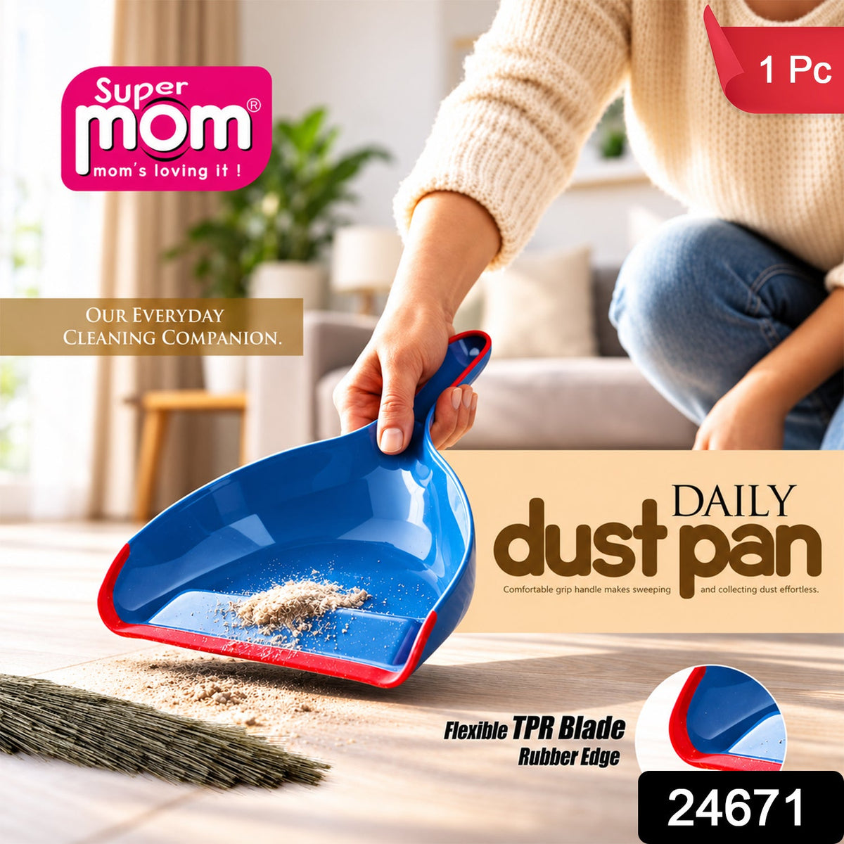 A person holds a blue and red dustpan with collected dirt, next to a broom on a wooden floor. – view 2