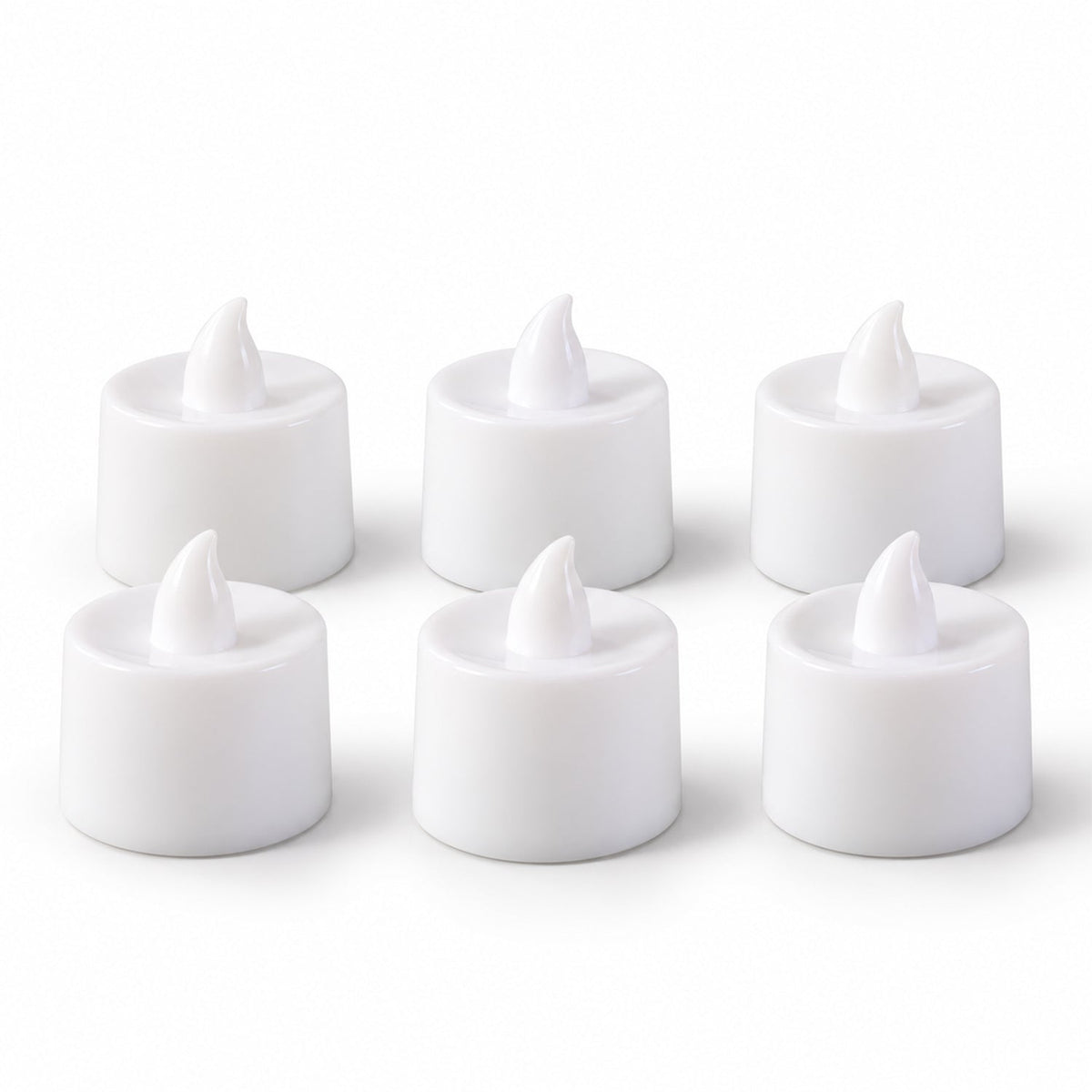 Six white flameless tealight candles with realistic flame-shaped tops are neatly arranged in two rows on a plain white