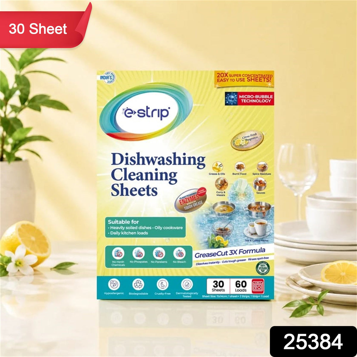 A box of e-strip dishwashing cleaning sheets on a counter with lemons, white flowers, and dishware, with a red banner and