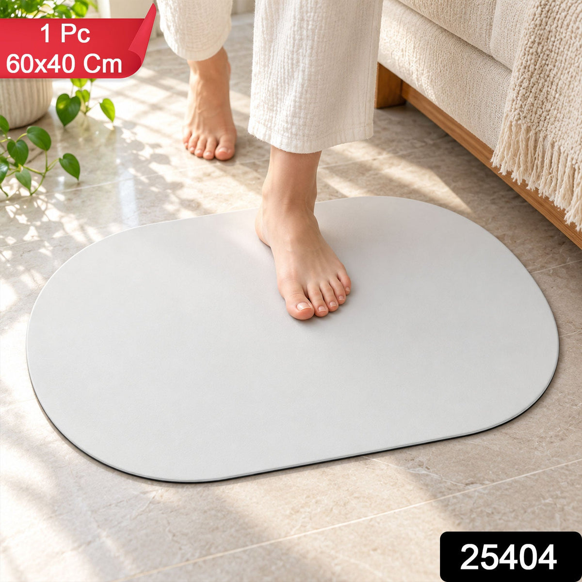 A white oval mat on a tiled floor with bare feet, next to a sofa and green plant.
