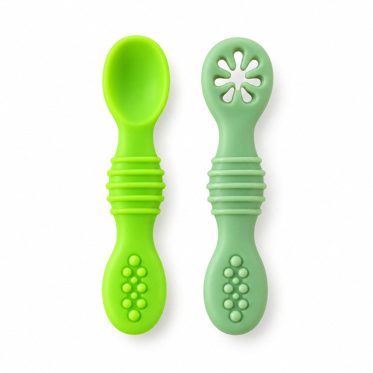 Two green silicone baby spoons, one solid and one with a flower-shaped teether, on a plain white background.