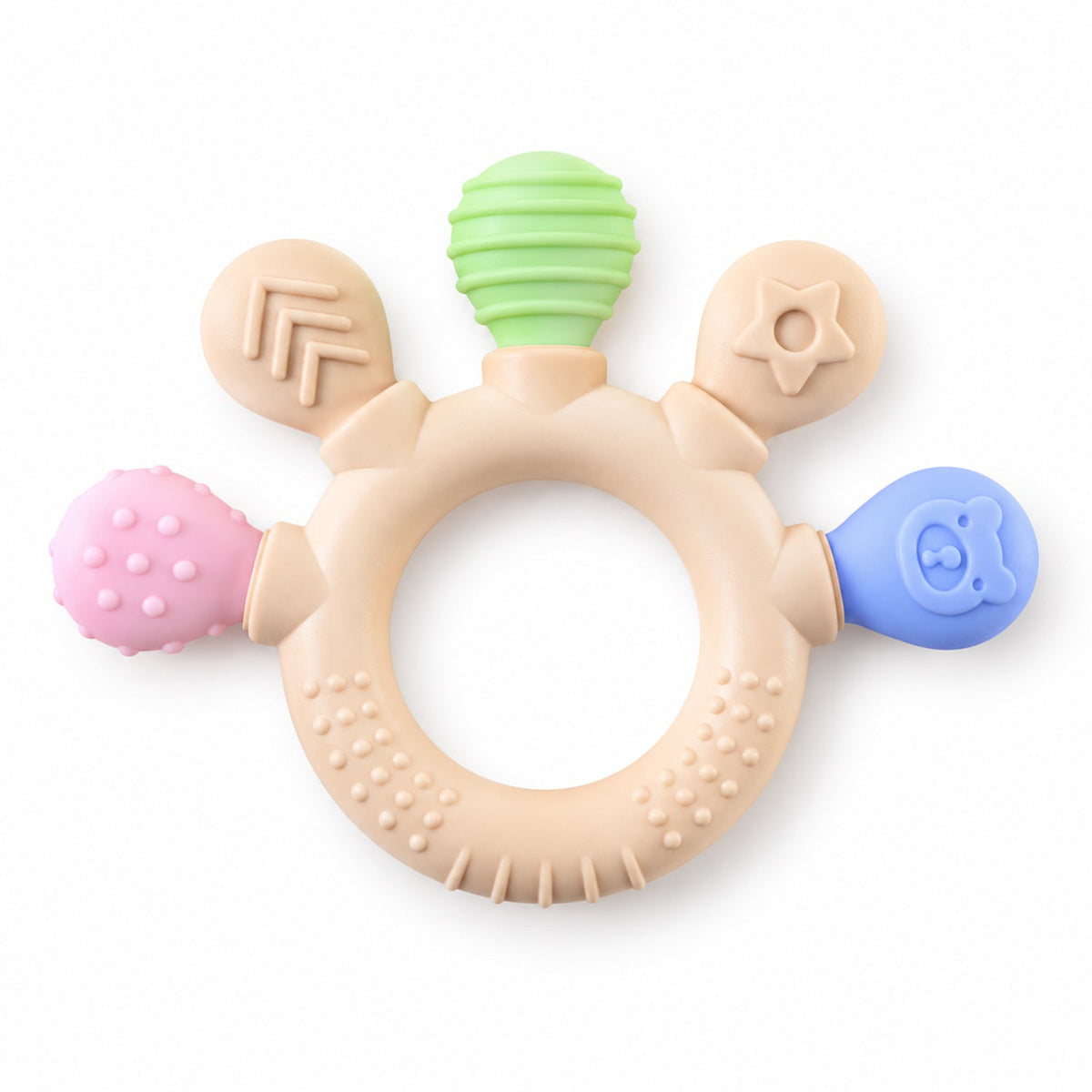 A beige silicone teether with green, pink, and blue textured ends and a ring shape is displayed on a white surface.