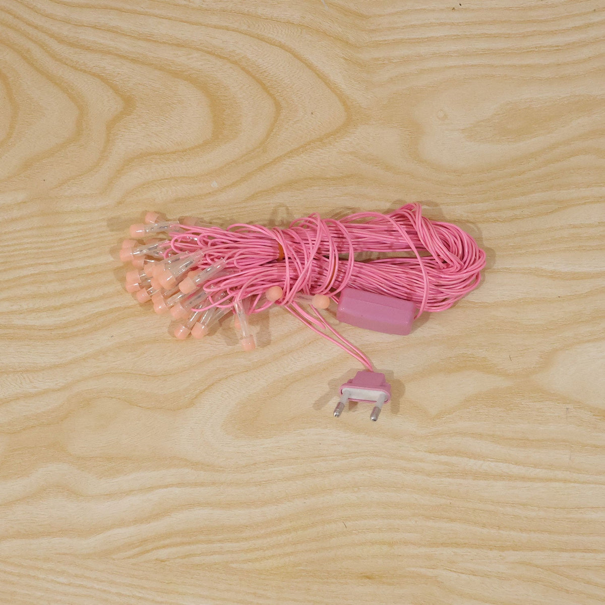 Pink LED curtain string lights used for home decor