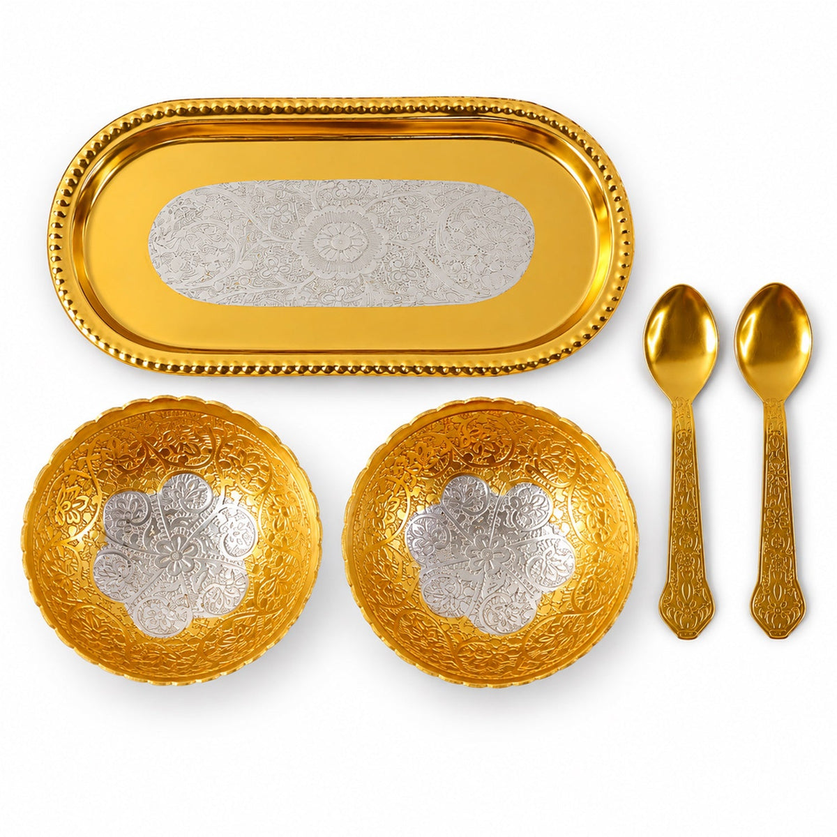A top-down view of a golden tray, two golden bowls with silver floral patterns, and two golden spoons.