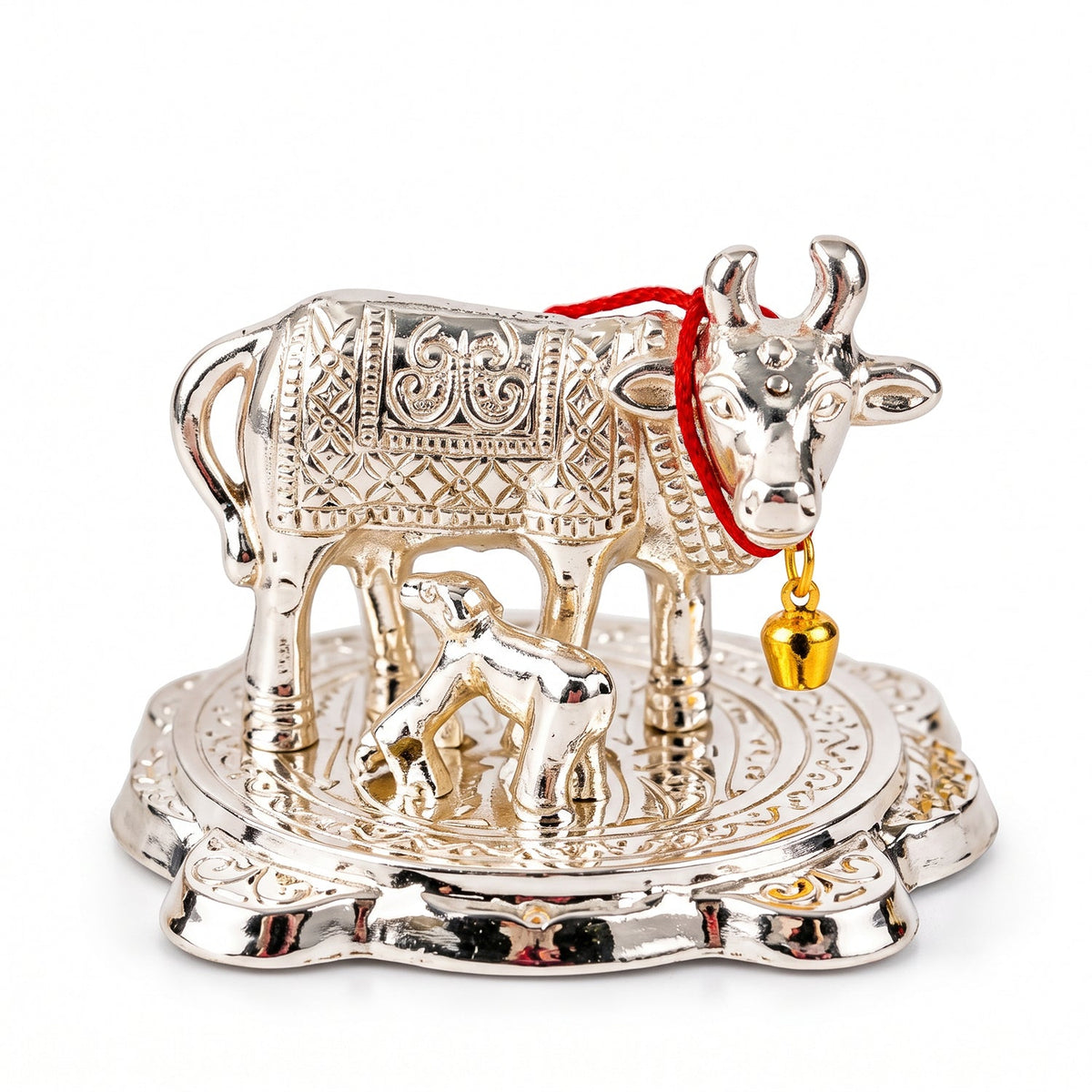A detailed front view of the silver Kamdhenu cow and calf idol on a white background.