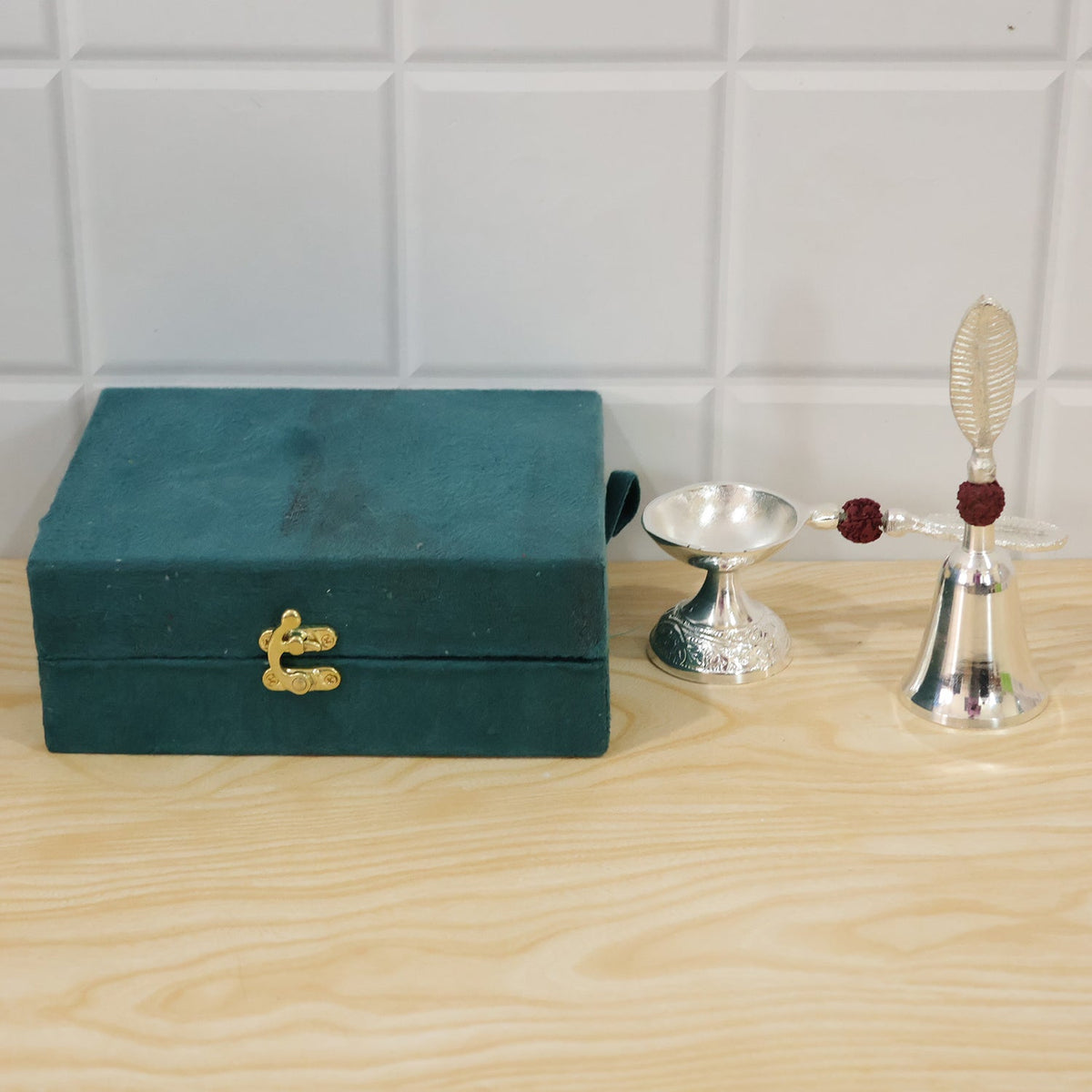 Silver finish pooja set used as home decor for worship