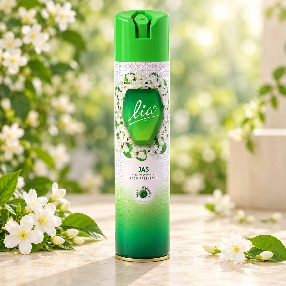Green and white Lia Jas room freshener aerosol can with jasmine blossoms on a light-colored stone surface.