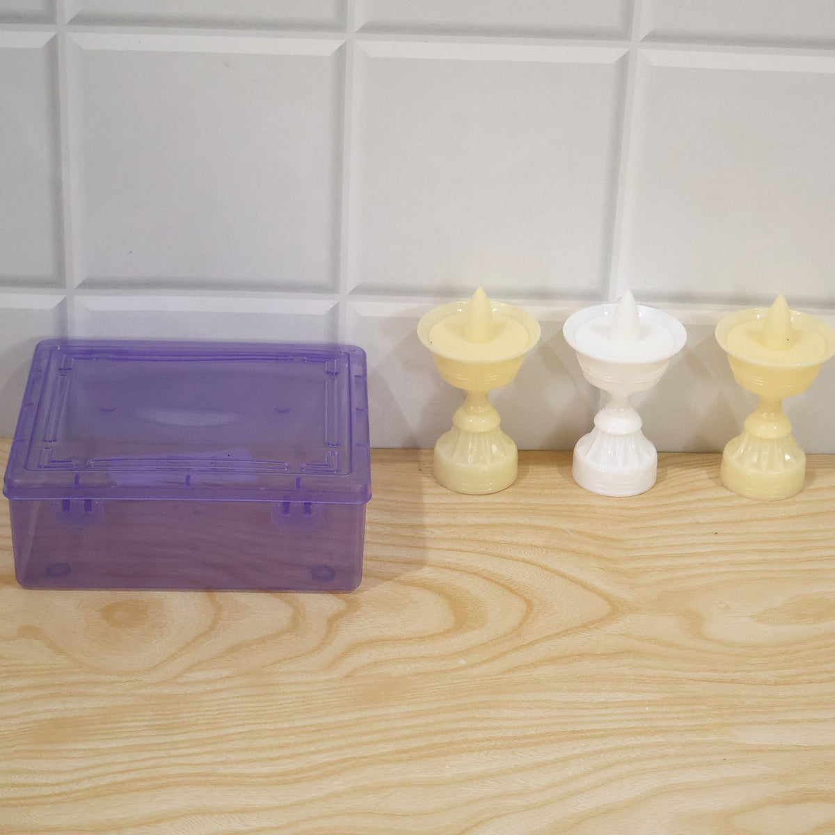 Three flameless LED diyas in their plastic box packaging
