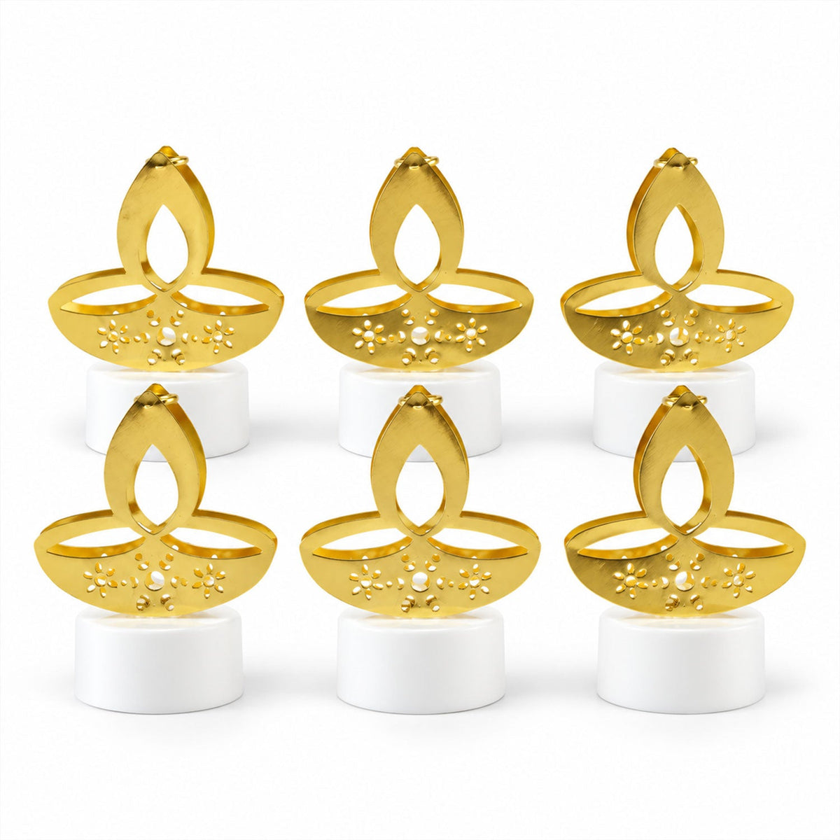 Arrangement of golden flameless diyas creating a festive ambiance